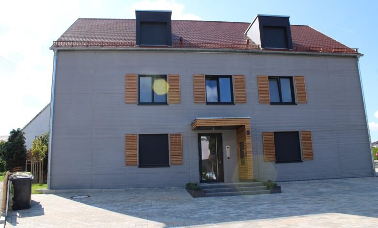 Finished 3D printed house with layered concrete walls in Germany