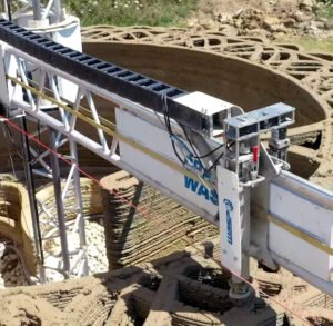Robotic 3D printer arm building the walls of a sustainable printed house